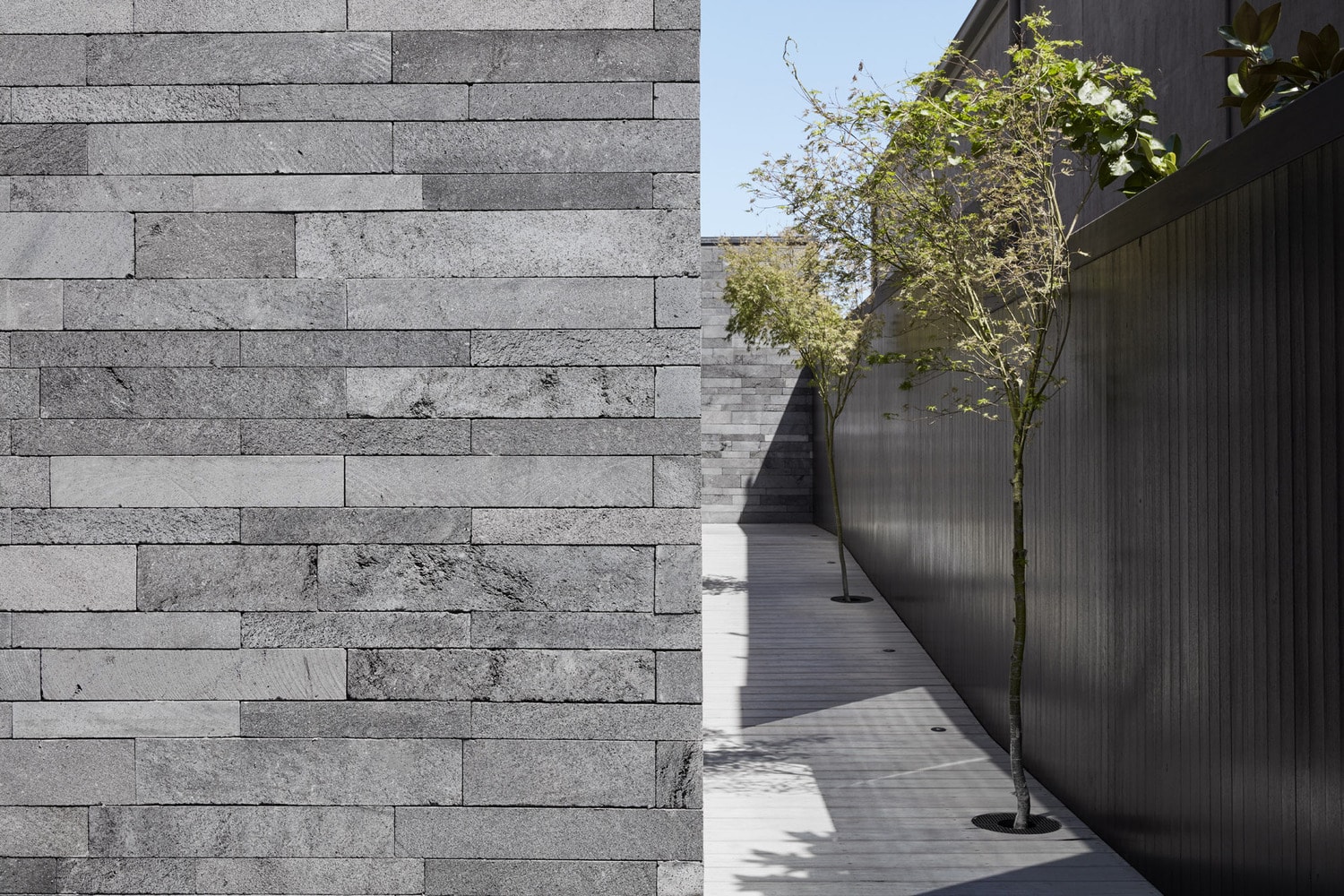 Norstone Planc in a custom platinum blend used on the exterior walls of an urban outdoor space.